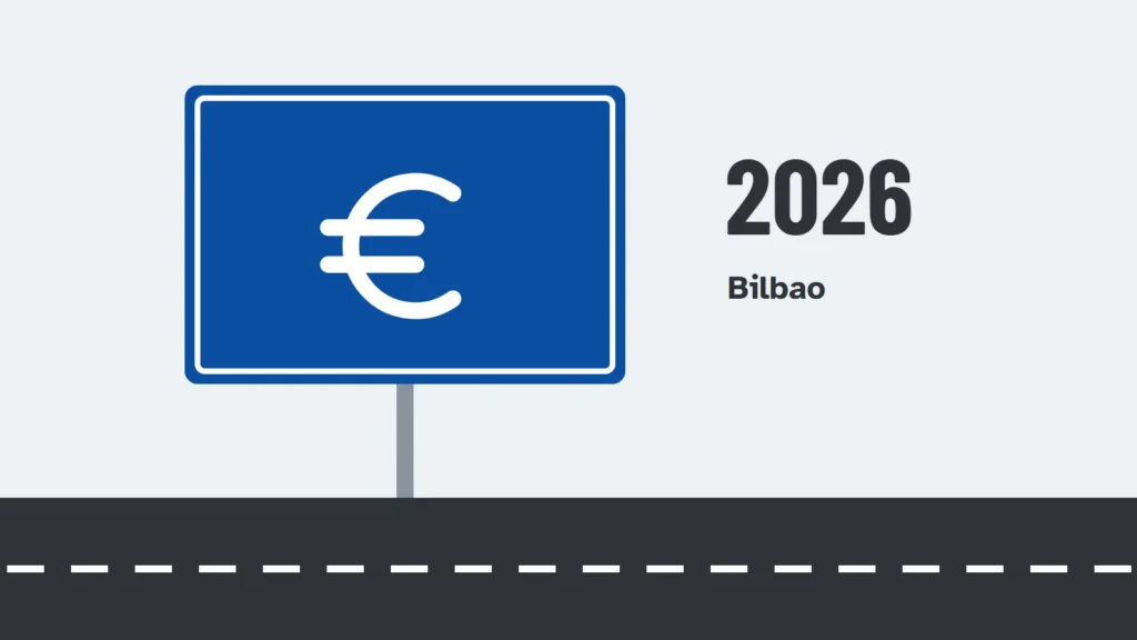 Panel azul de carretera con el símbolo del euro junto a una carretera
